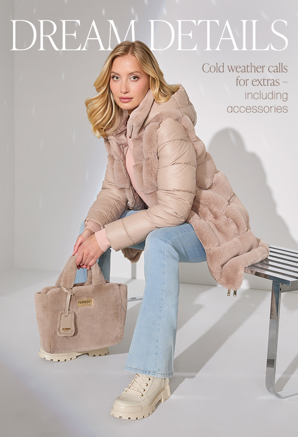 image of a model in a pink quilted longline puffer jacket with faux-fur trim with bag and boots