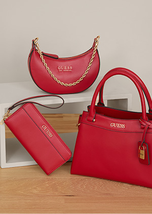  image of three red-pink faux-leather handbags in various sizes and shapes