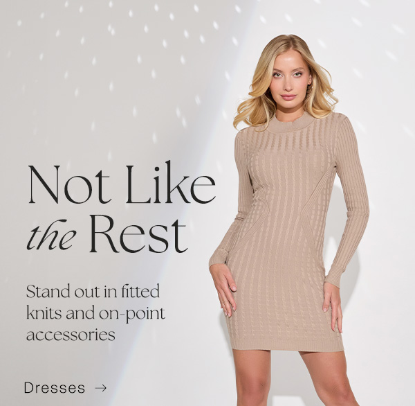 image of a model in a fitted tan sweater dress with mock neck and slouchy boots